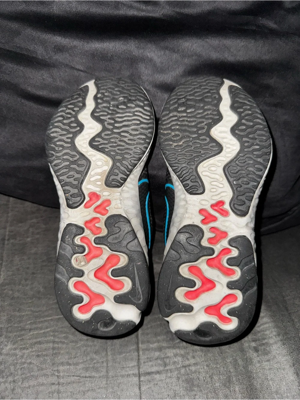 Renew Nike Kids size 13. Running Black Sneakers with Blue and neon pink .